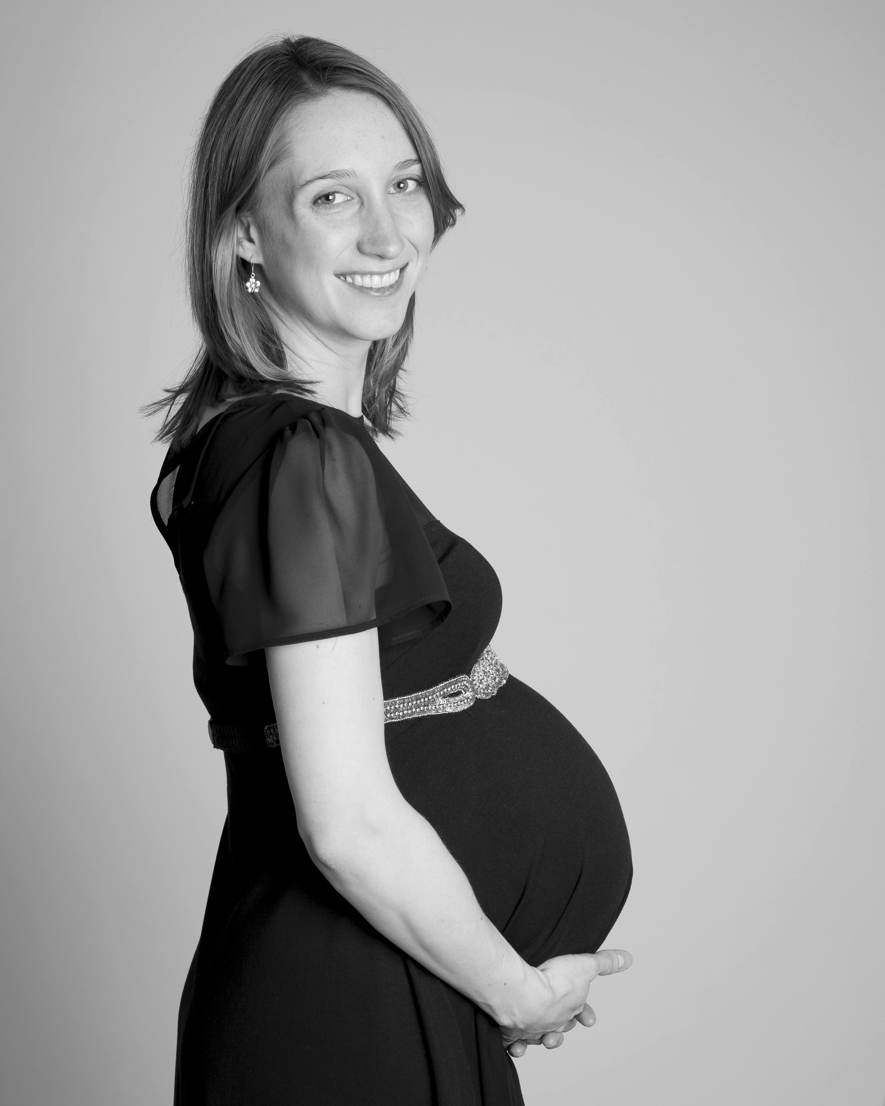 pregnant lady in black dress by Winchester maternity photographer