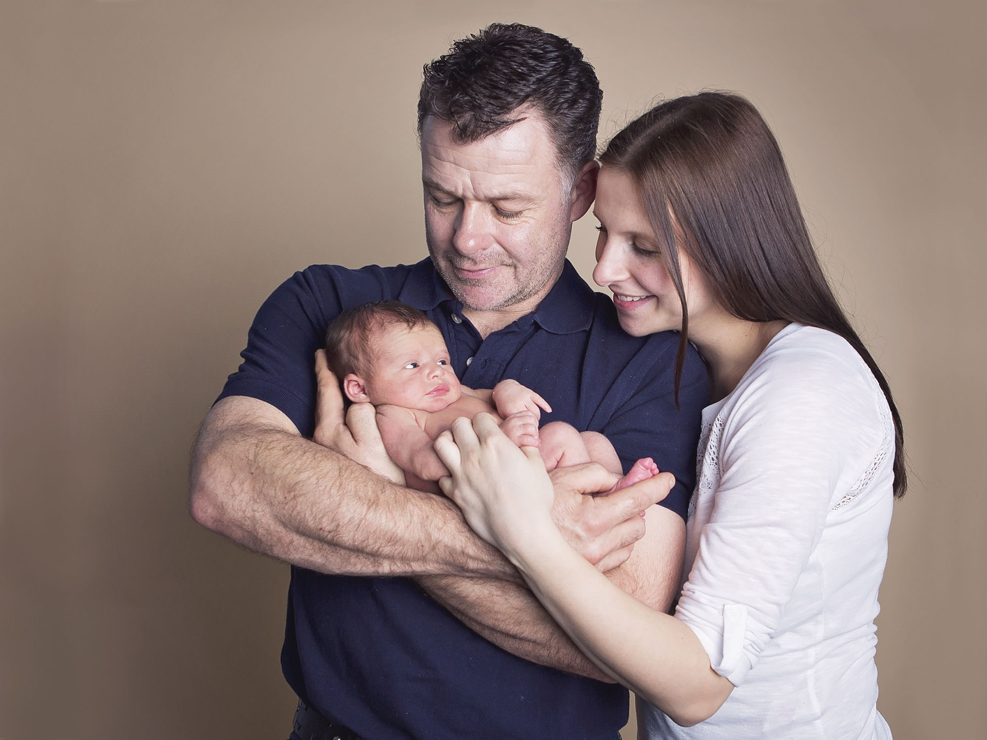 mum, dad and new baby by newborn photographer Winchester