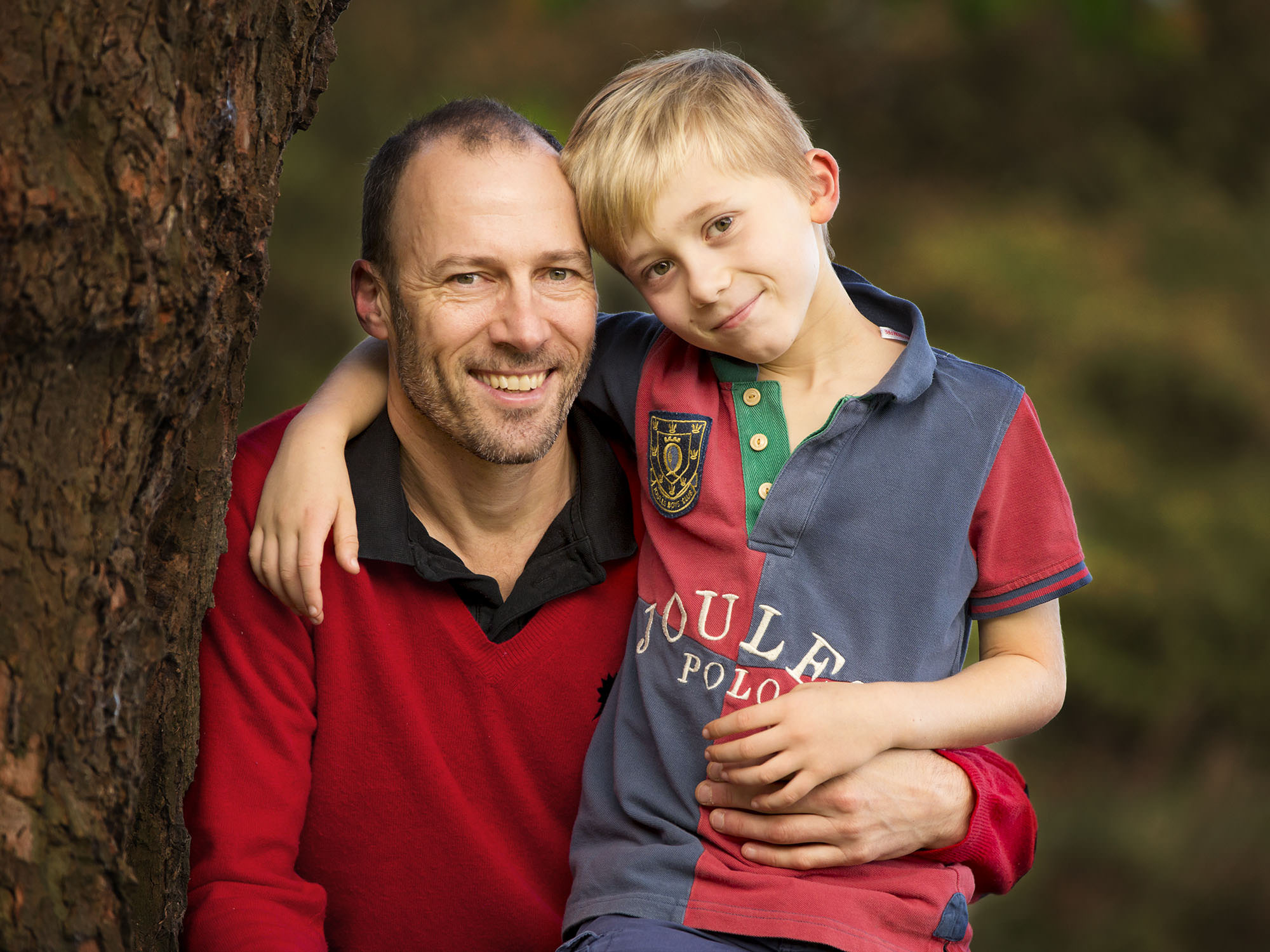 Dad and son outdoors by family photographer Winchester