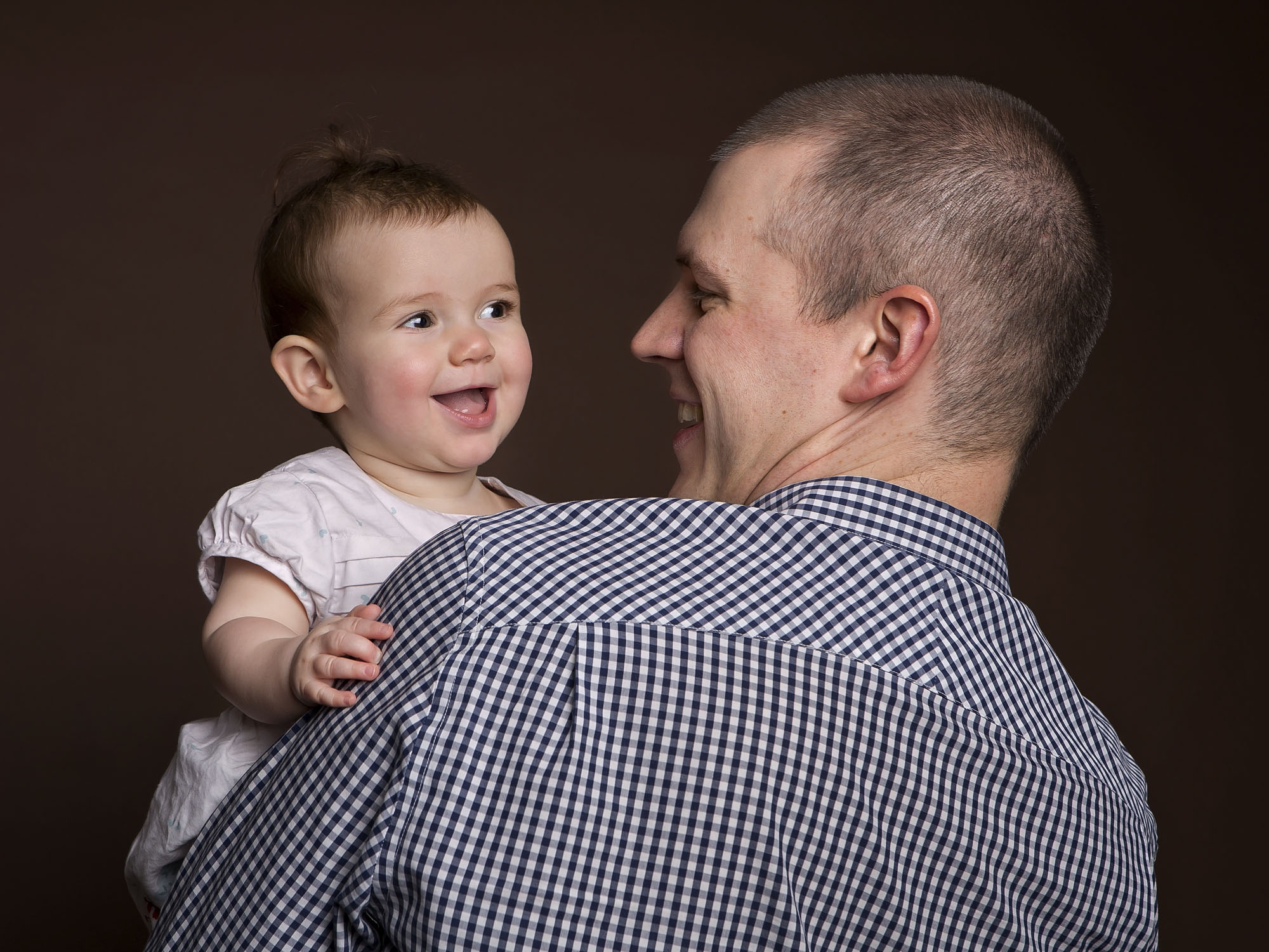 Dad and baby by family photographer Winchester