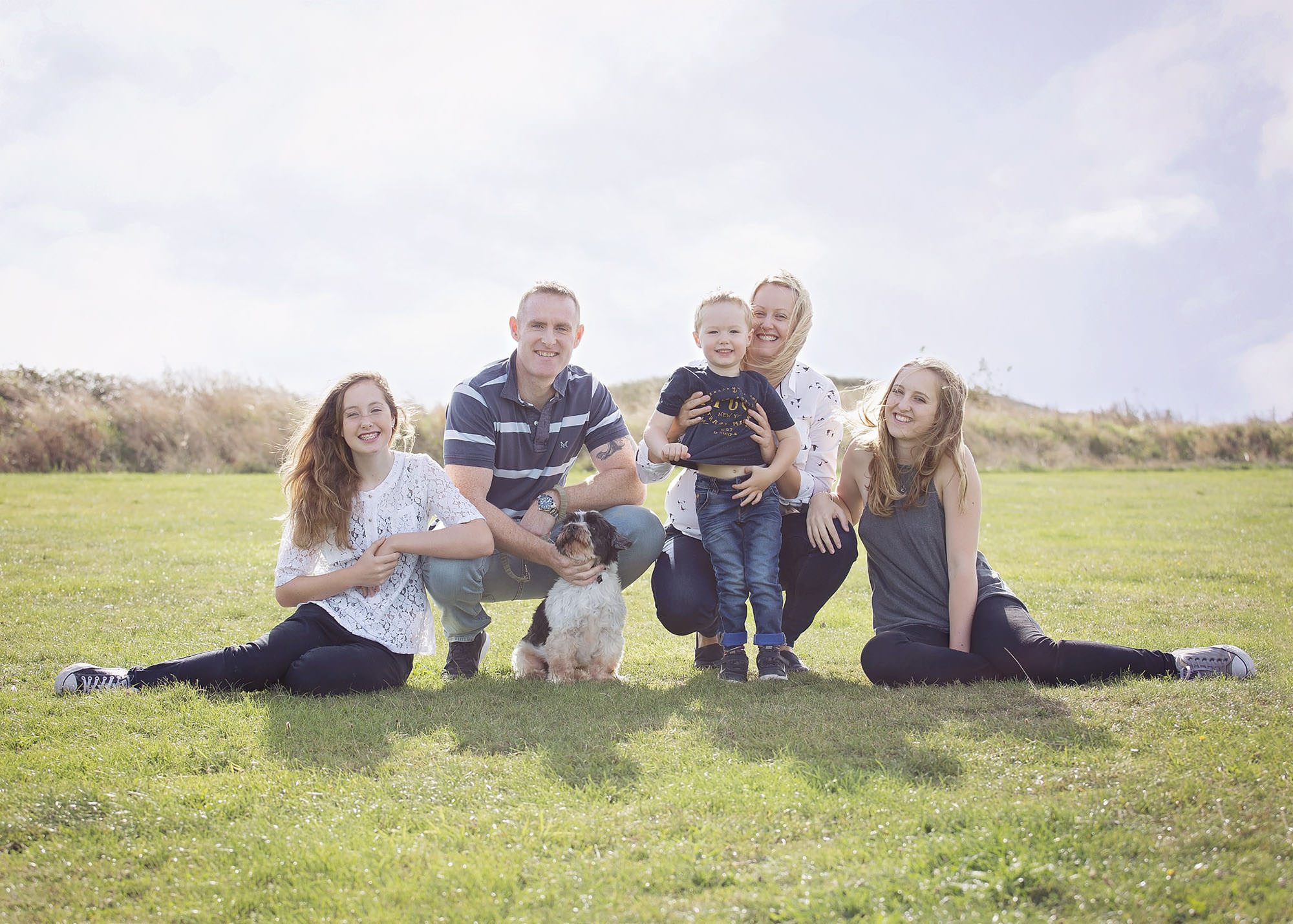 Family outdoors by family photographer Winchester