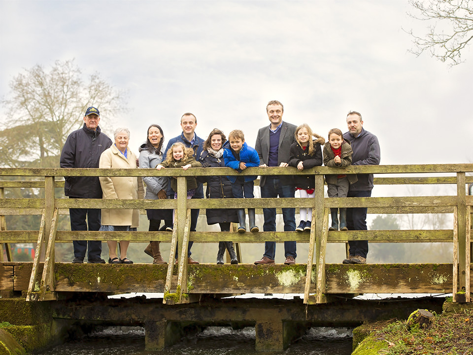 Family on bridge by family photographer Winchester