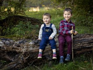 brothers on a tree trunk by Winchester family photographer