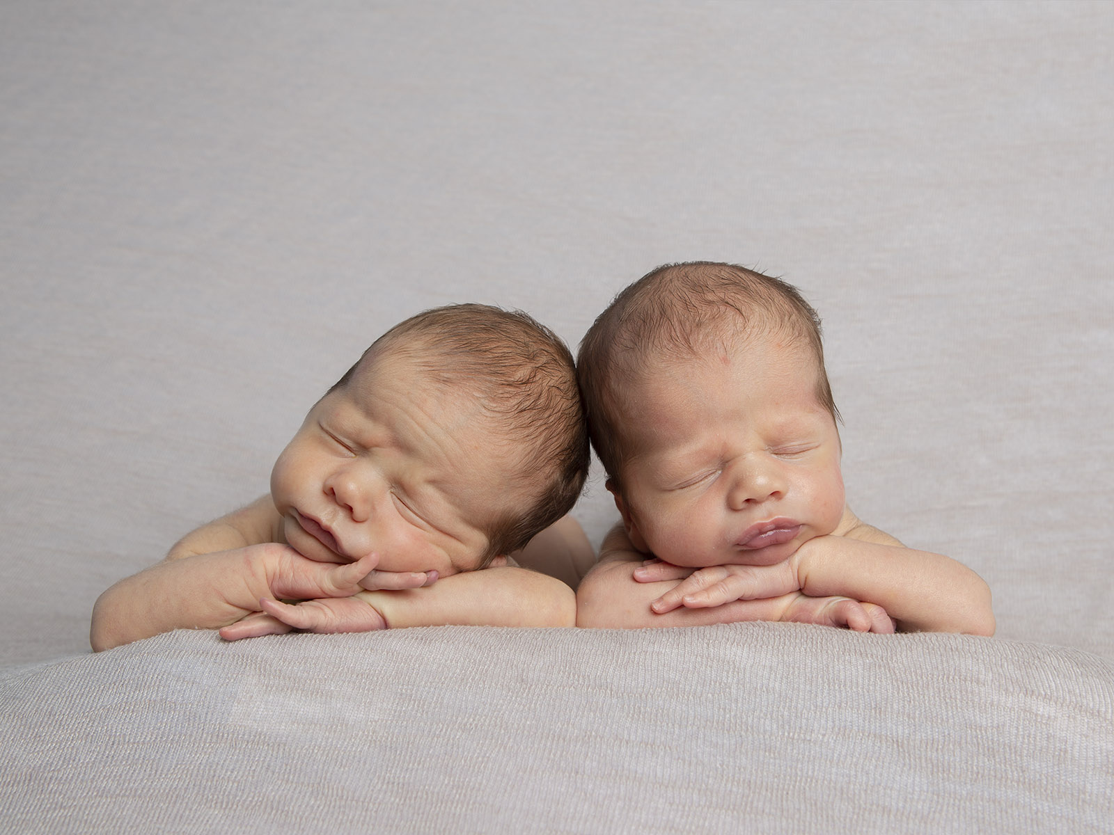 sleeping twin babies by Newborn photographer Winchester