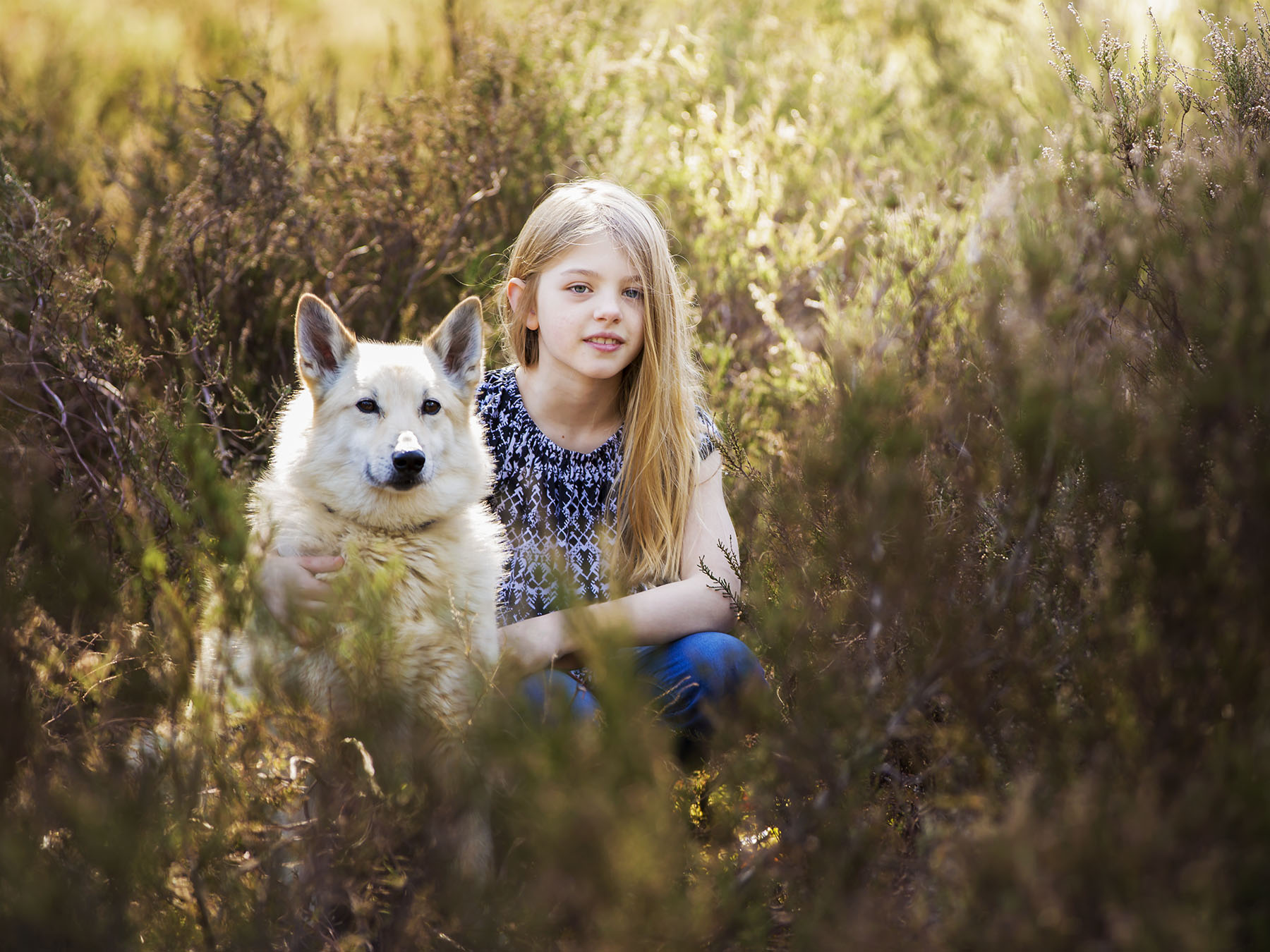 Girl and dog in bushes by family photography Winchester 