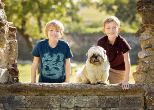 brothers and their dog at Netley Abbey in Hampshire