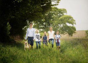 family walking in the fields in Hampshire