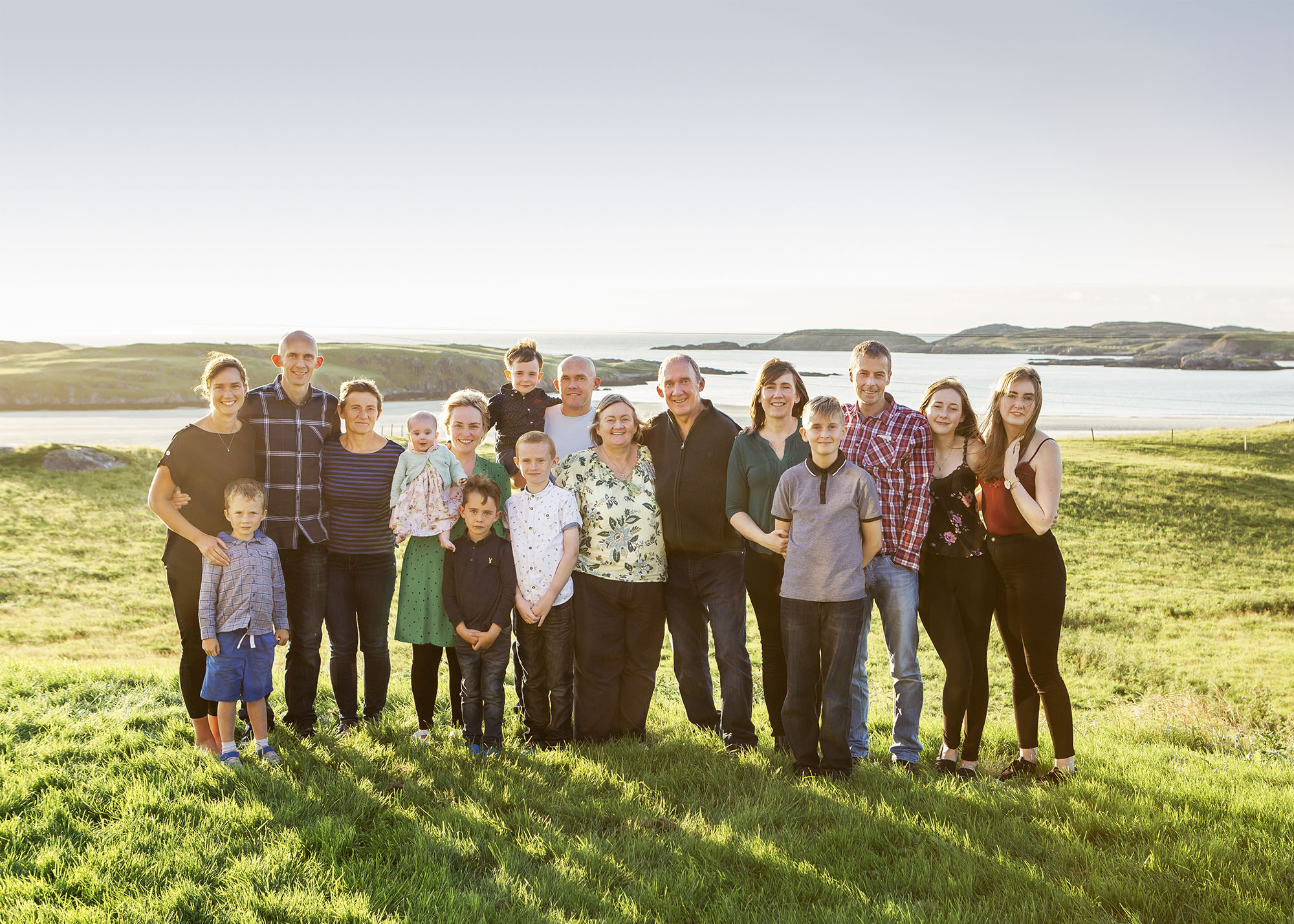 Family together outdoors by family photographer Hampshire 