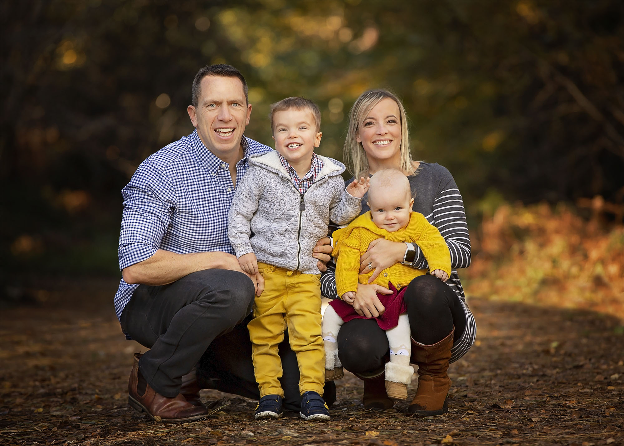 Parents and son with baby by family photographer Winchester 