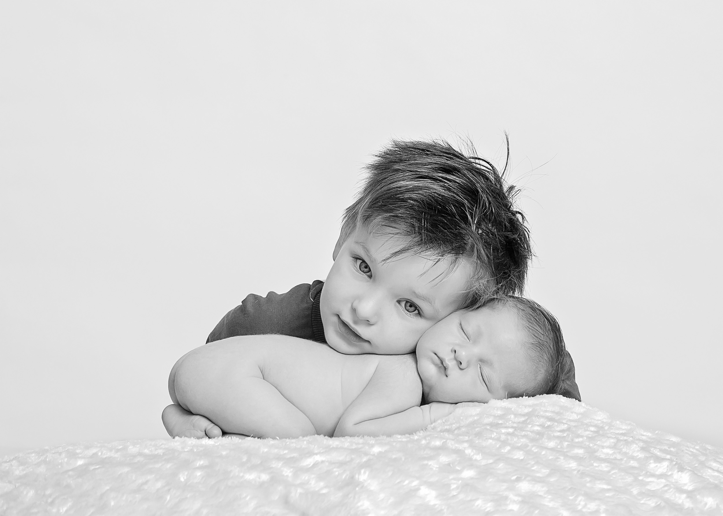 sleeping newborn and his big brother by Winchester newborn photographer