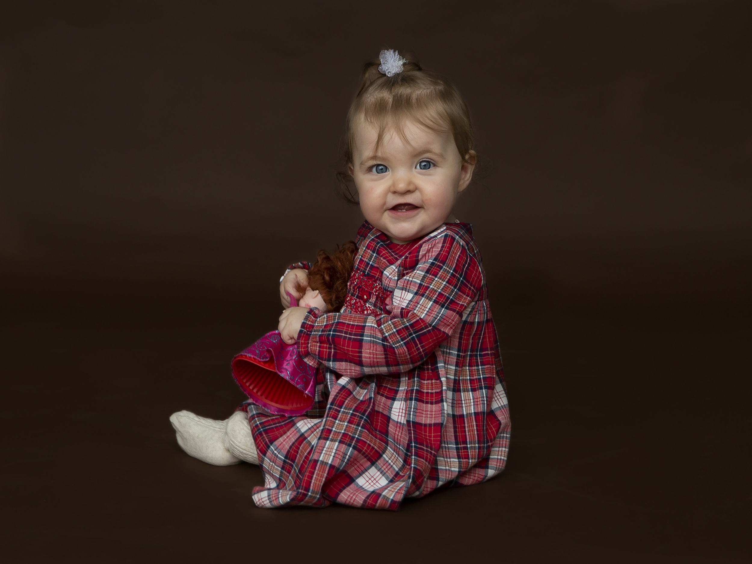 baby in tartan dress by Winchester family photographer
