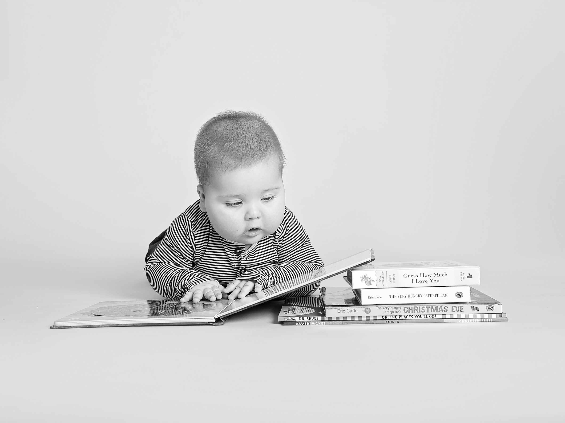 baby reading books by Winchester baby photographer